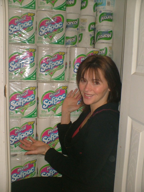 Kathy Spencer shows off her stockpile of toilet paper - all of which she got for free